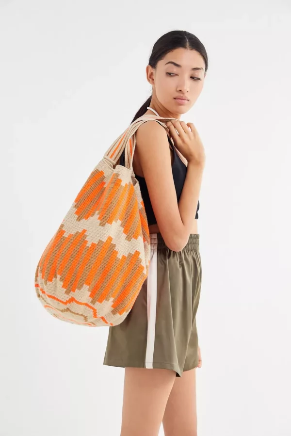 Woman using a wayuu tote bag made in colombia