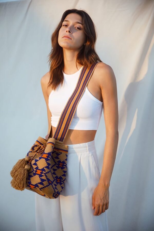 woman wearing a wayuu large bag from colombia